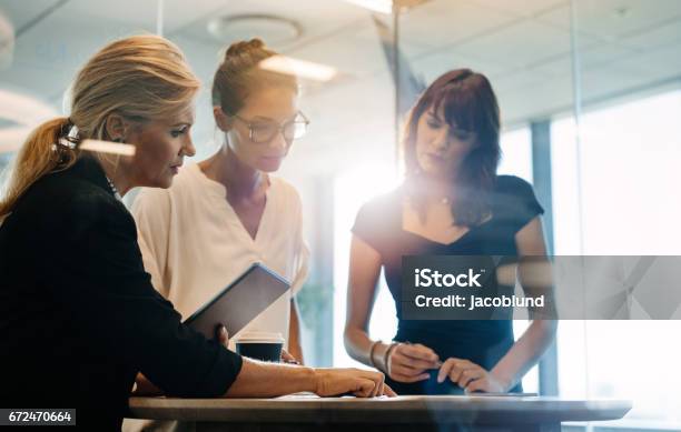 Businesswomen Brainstorming Over New Business Ideas Stock Photo - Download Image Now