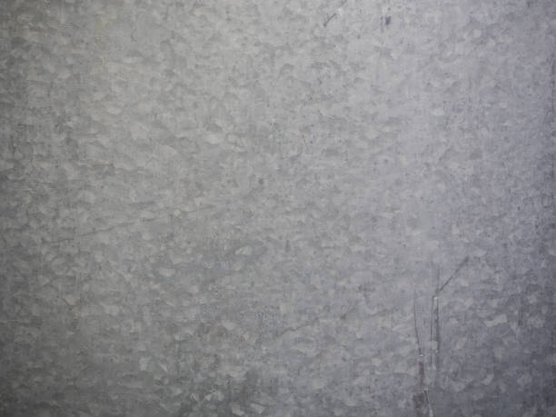 istock galvanized steel plate background , metallic stainless corrugated chrome texture 672470894