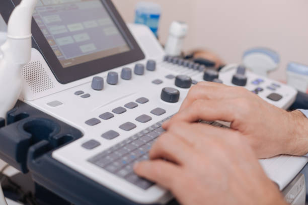 istock Skillful sonographer using professional equipment in the clinic 672475114