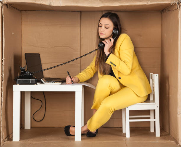 istock business woman talking on the phone and making notes at one time 672478230