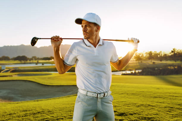 istock Male golfer with golf club at course 672479224