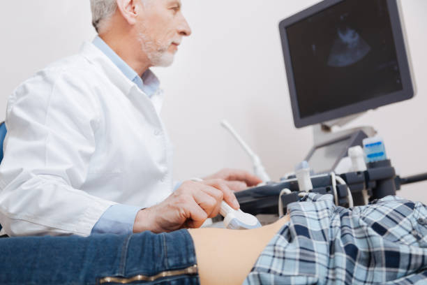 istock Pleasant physician providing appointment in the sonography cabinet 672481586