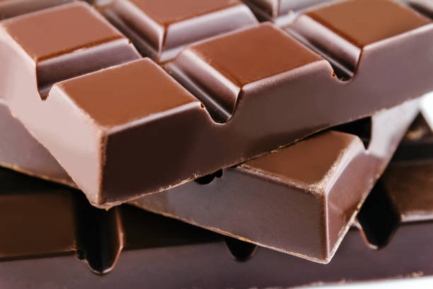 istock Three pieces of bitter, dark chocolate bar, close-up view 672481608