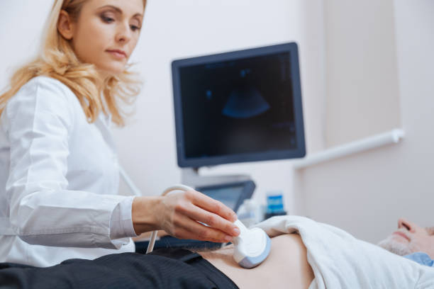 istock Proficient physician using ultrasound machine in the clinic 672483216