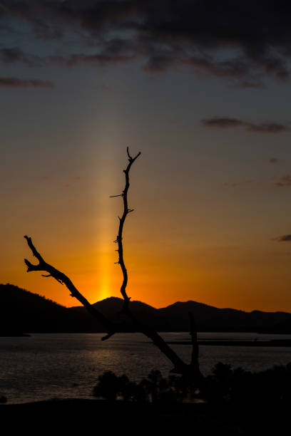 istock Sun Pillar at Sunset overlooking a Lake 672486686