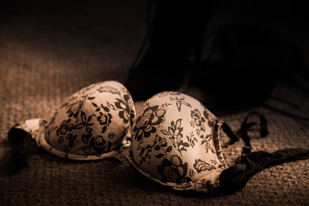 istock Bra on the floor with shoes 672489926