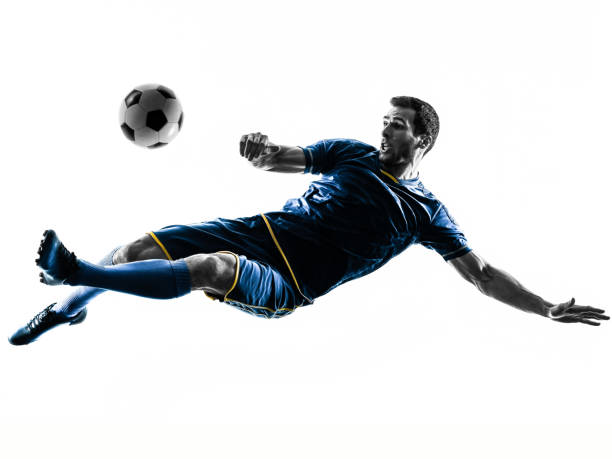 soccer player man kicking silhouette isolated one caucasian soccer player man playing kicking in silhouette isolated on white background sports activity stock pictures, royalty-free photos & images