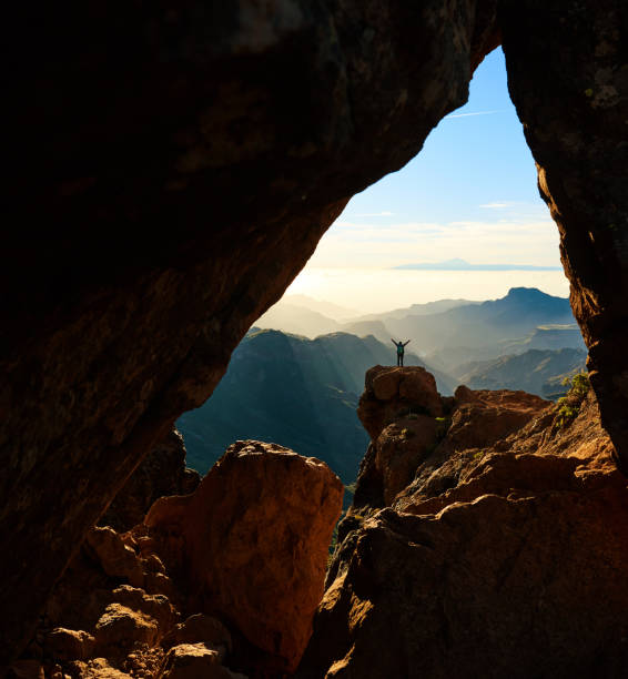 istock admiring the Roque Nublo mountain 672495294