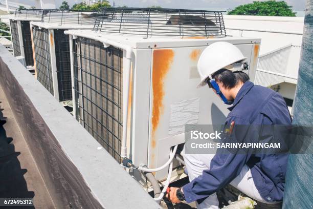 Technician Is Checking Air Conditioner Stock Photo - Download Image Now - Air Conditioner, Consumerism, Installation Art