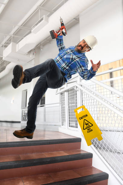 worker falling down stairs - falling people tripping senior adult stock-fotos und bilder