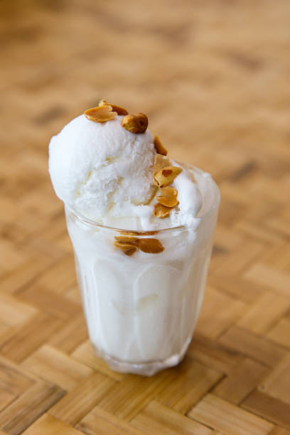 istock Coconut ice cream with nuts, served in glasses 672503054