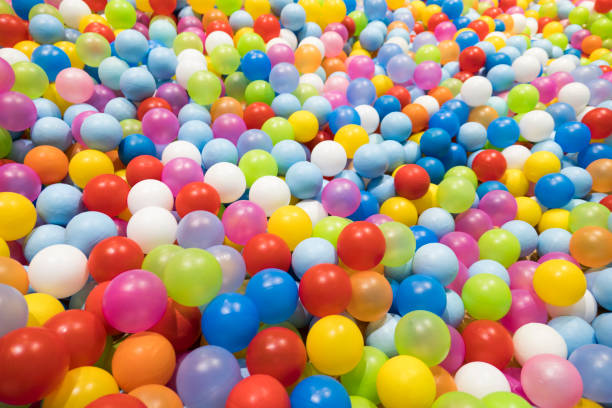 istock Colorful Plastic Balls in Children Playground 672507582