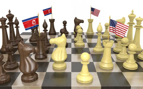 North Korea and United States strategic relations and foreign policy struggles represented by a chess game rendered in 3D.