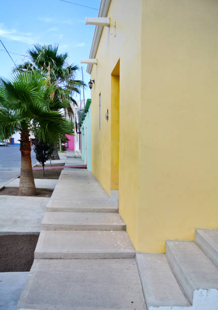 istock white staircase on the wall of yellow background 672526936