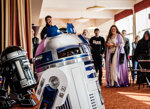 Models of droids R2-D2 and C2-B5 from the 'Star Wars' series being admired by fans at the Sci-Fi Scarborough convention.