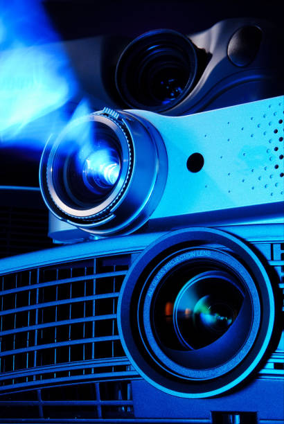 istock Technology equipment operating the projector in the dark 672532186