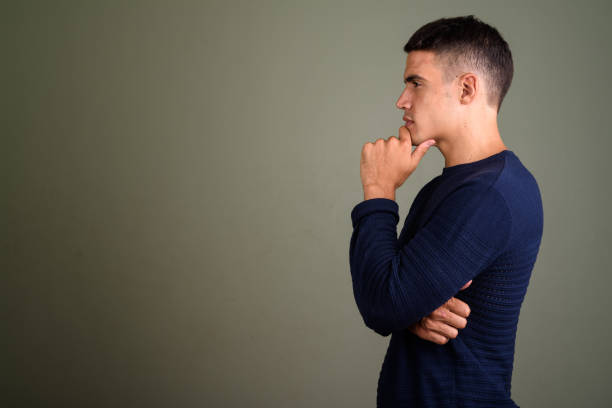 istock Studio shot of young handsome man against colored background 672535672