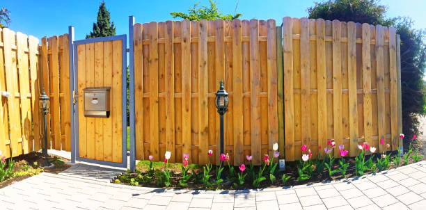 istock Wooden fence on a property 672541550