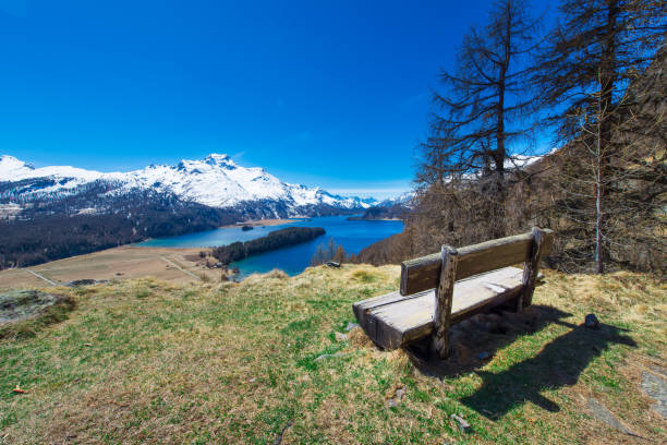 istock View of the Engadin valley from a wooden bench 672542428