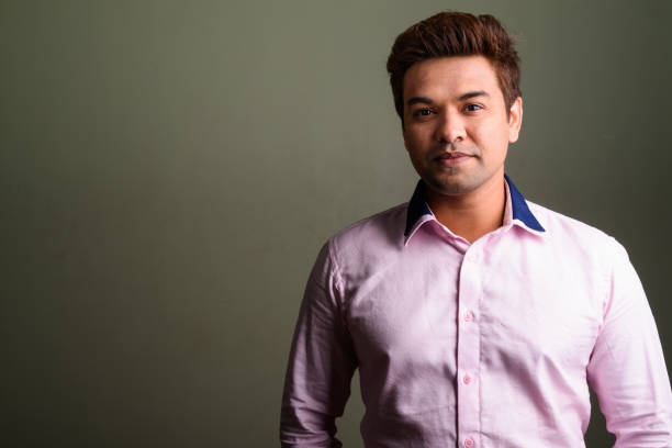 istock Studio shot of Indian businessman against colored background 672546486