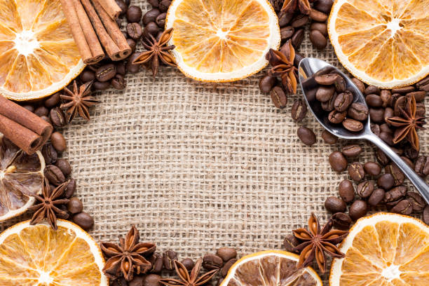 istock orange slices with coffee beans and spices on canvas background 672546514