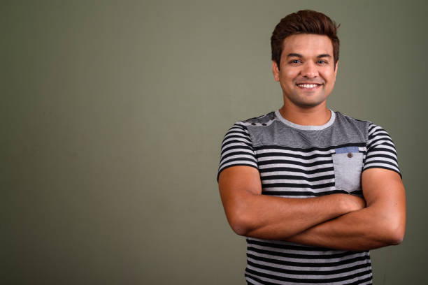 istock Studio shot of Indian man against colored background 672551122
