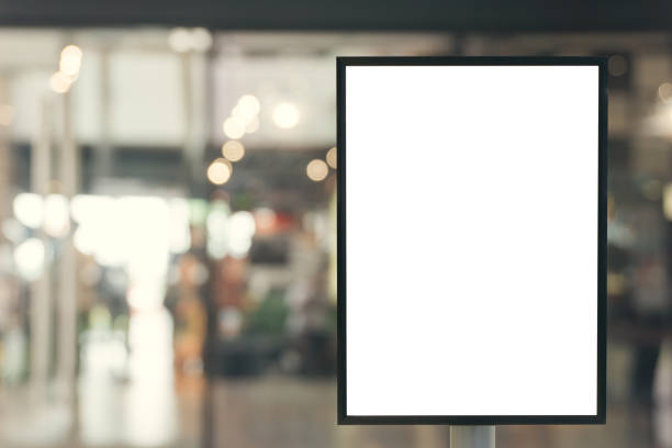 istock Blank mock up of vertical poster billboard sign with copy space for your text message or content in modern shopping mall. 672551142