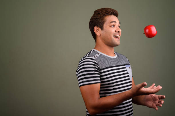 istock Studio shot of Indian man against colored background 672551170