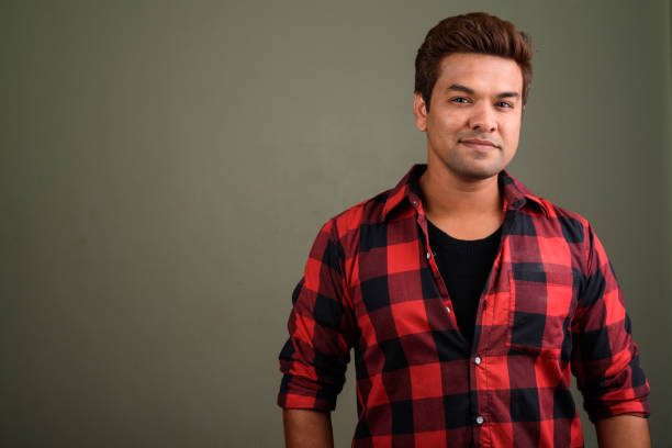 istock Studio shot of Indian man against colored background 672551270