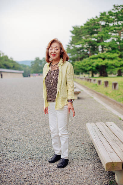 istock Active seniors in Japan - senior woman resting on bench 672552132