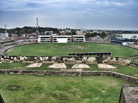 View from the Galle Fort in southern Sri Lanka overlooking a cricket ground with people playing
