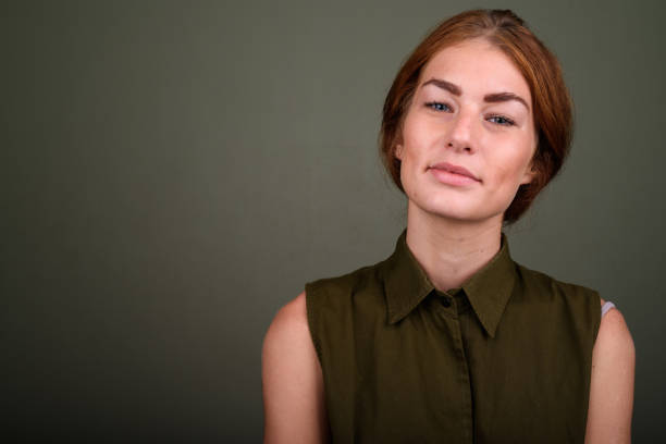 istock Studio shot of young woman against colored background 672565938