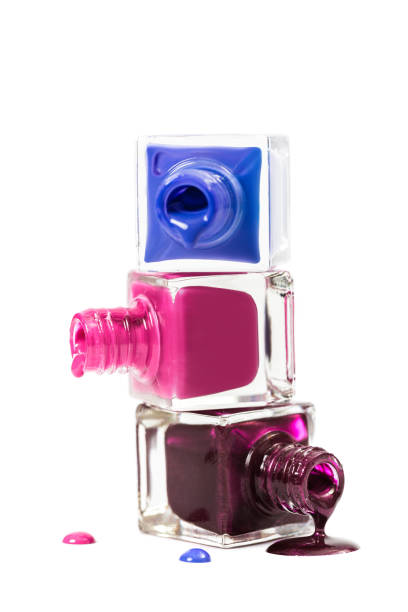 istock Stack of nail polish isolated on white background 672578344