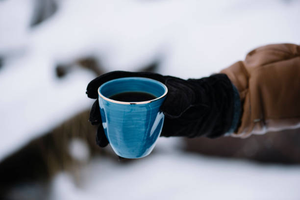 istock Man holding a cup of freshly brewed coffee 672582652