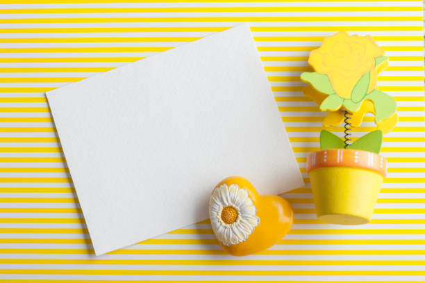 istock Mock-up, empty paper note, yellow wooden flower 672589664