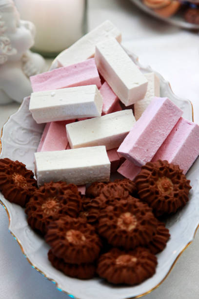 istock Chocolate cookies and fruit candy in a plate 672593230