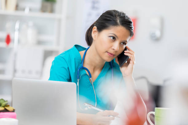 istock Nurse uses phone at the hospital 672596852
