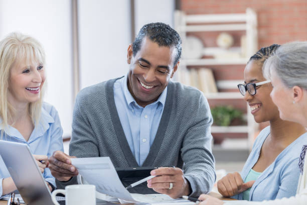 istock Diverse businesspeople discuss something during meeting 672597004
