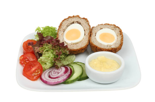 istock Scotch egg and salad on a plate 672599588