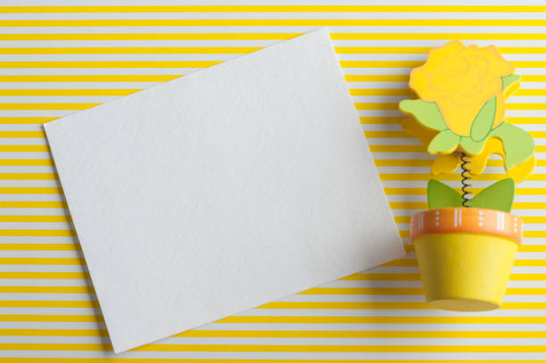 istock Mock-up, empty paper note, yellow wooden flower 672608816