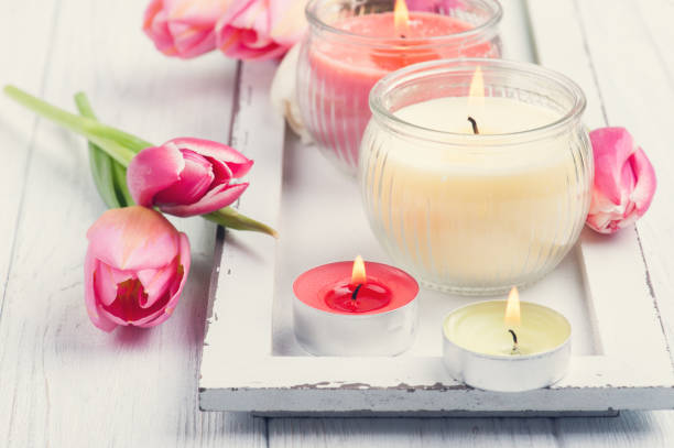 istock Yellow and pink aroma candles with tulips 672610350