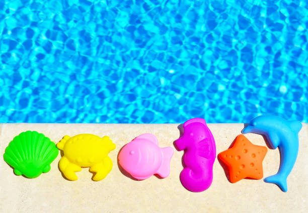 istock Baby Toys on the blue pool. 672610508