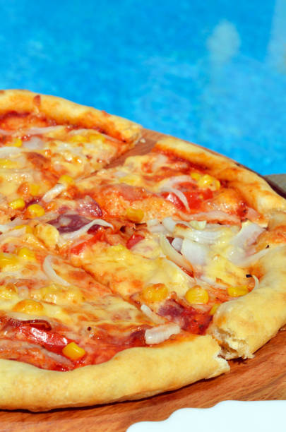 istock Pizza with corn, onions and smoked. 672612660
