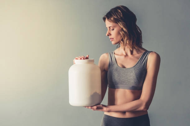 istock Woman with sport nutrition 672613418