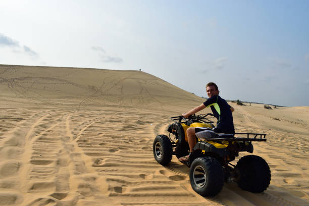 istock Driving with a ATV true the desert, mui ne, vietnam 672614654