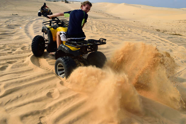 istock Driving with a ATV true the desert, mui ne, vietnam 672616982