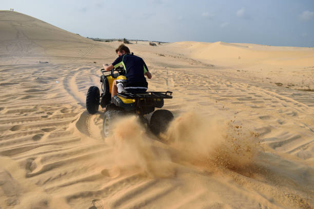 istock Driving with a ATV true the desert, mui ne, vietnam 672616994