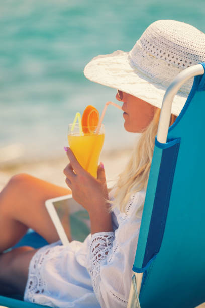 istock Young Woman Relaxing At The Beach 672617316