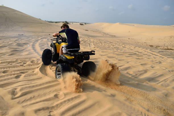 istock Driving with a ATV true the desert, mui ne, vietnam 672617492
