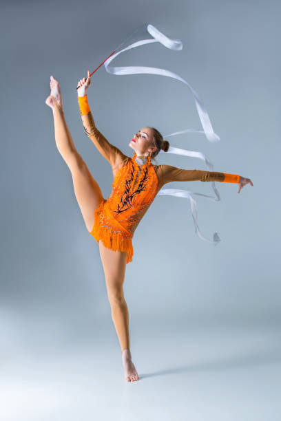 istock Young gymnast on a white background 672617766